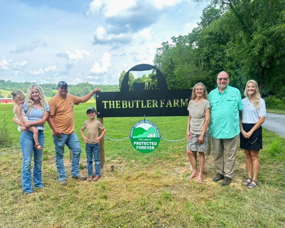Photo of Butler Farm and NCFPB in front of sign